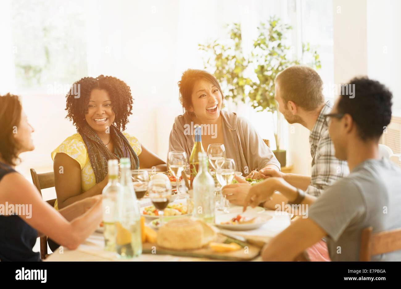 Group of friends enjoying dinner party Stock Photo
