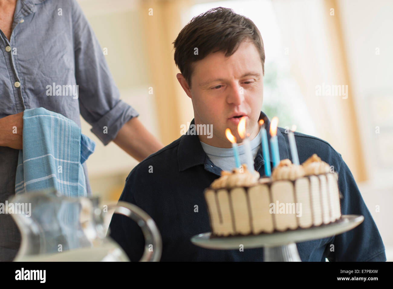 Man with down syndrome celebrating birthday Stock Photo