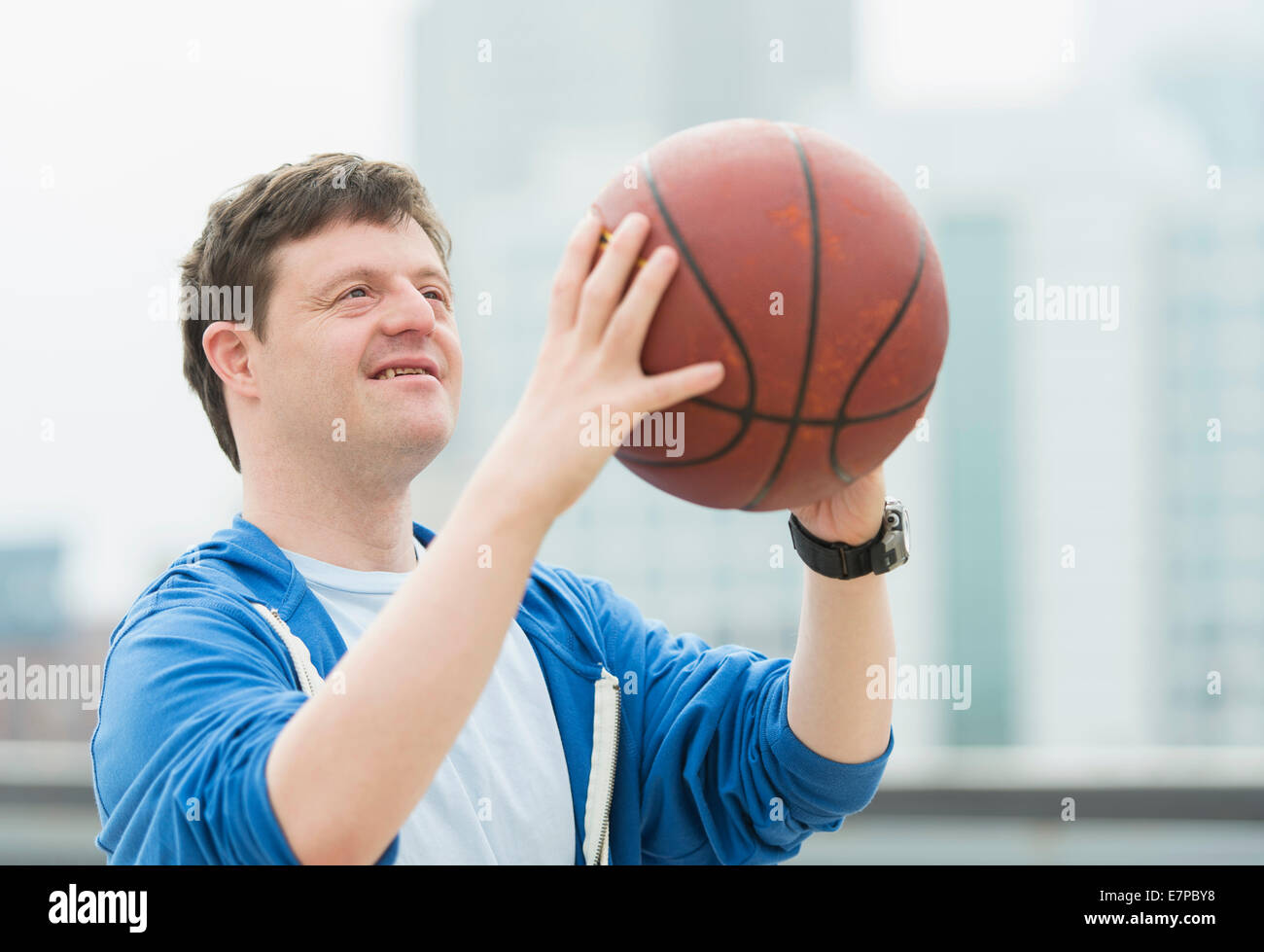 Man with down syndrome playing basketball Stock Photo - Alamy