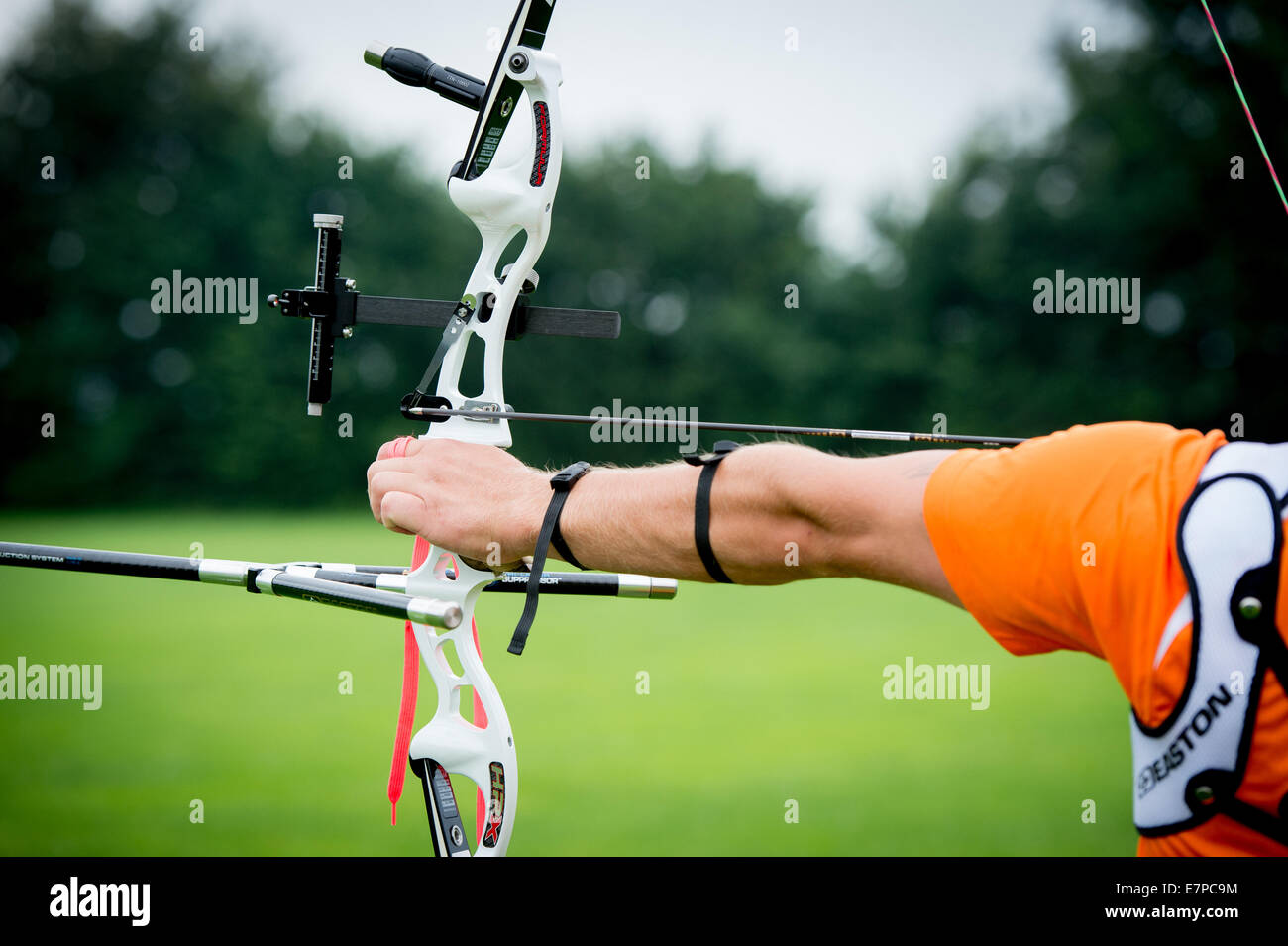 The archer put the arrow on his bow and is ready to shoot the arrow Stock Photo Alamy