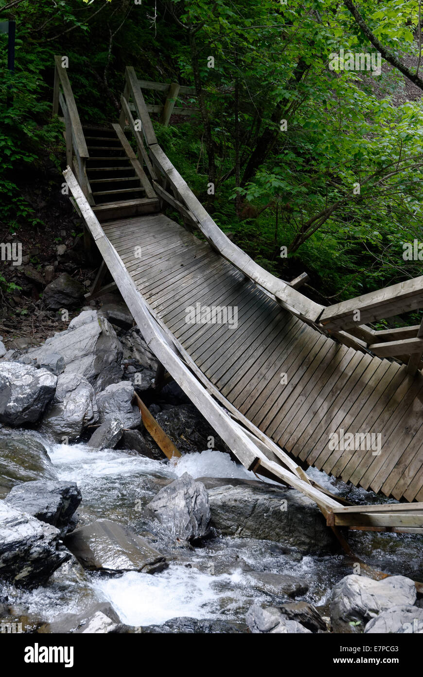 A wooden bridge destroyed by floodwater in the river, Gaspesie, Quebec, Canada Stock Photo