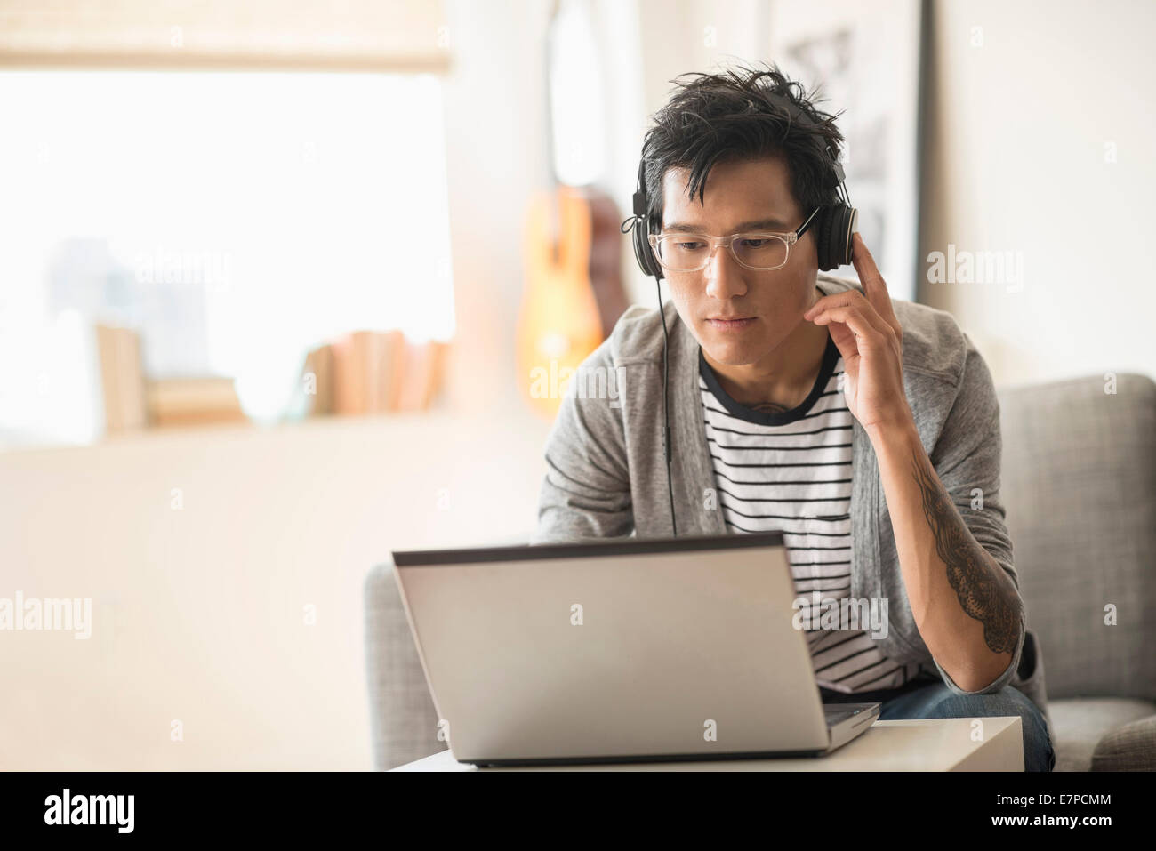 Man mixing music on laptop Stock Photo Alamy