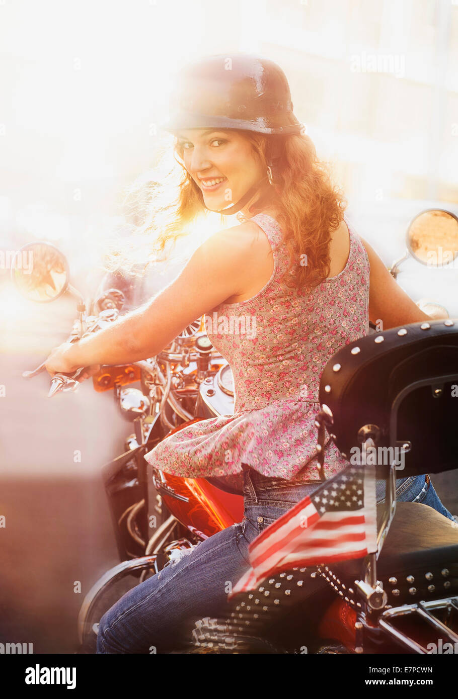 Young woman riding motorcycle Stock Photo