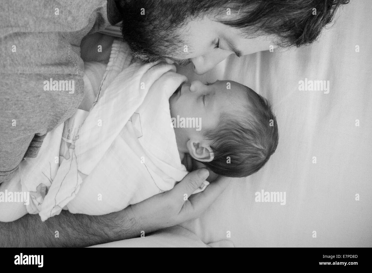 Father holding newborn daughter Stock Photo