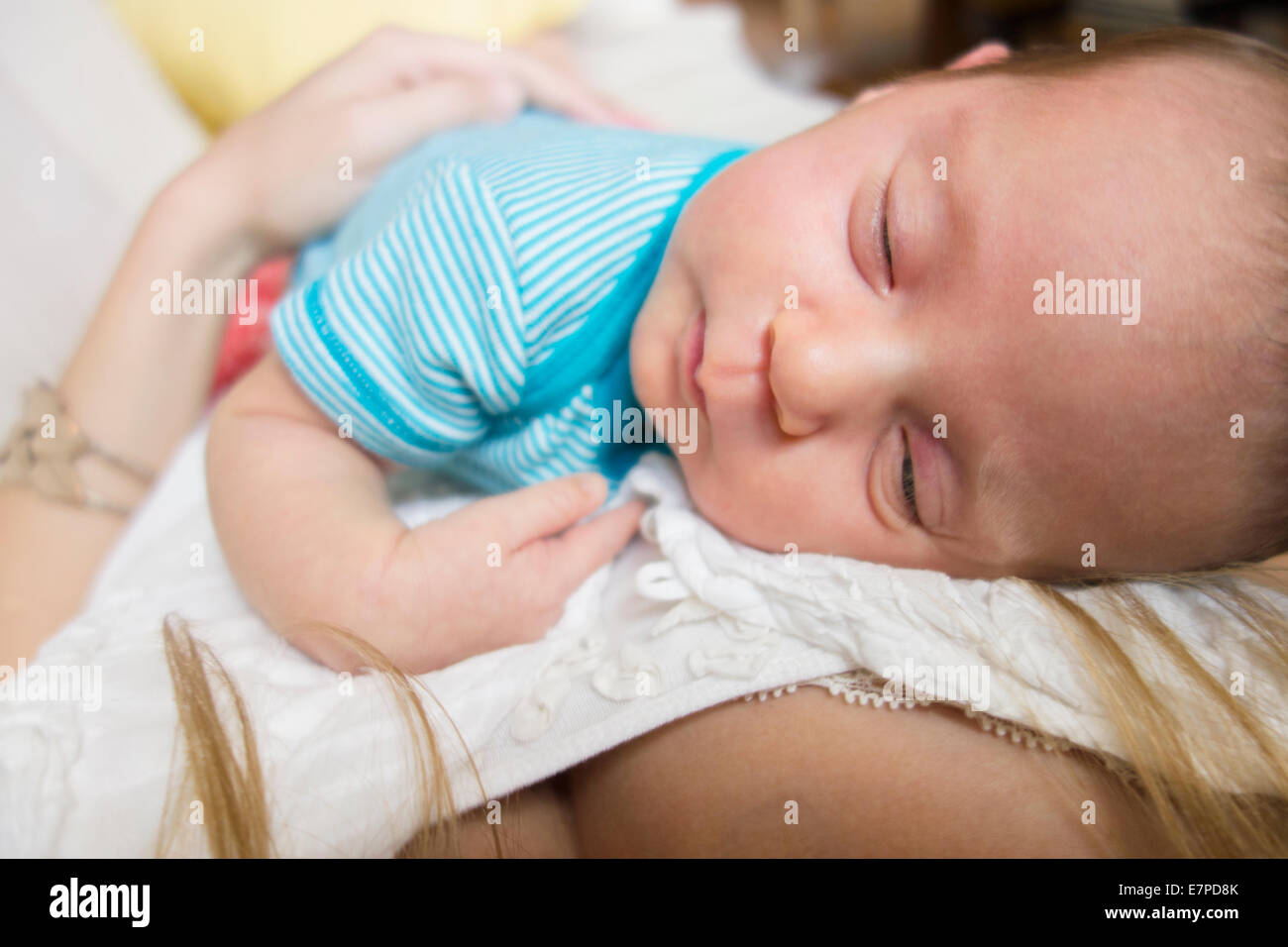 Mother holding newborn daughter Stock Photo