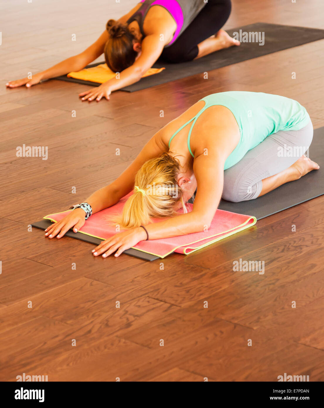 Women exercising yoga Stock Photo