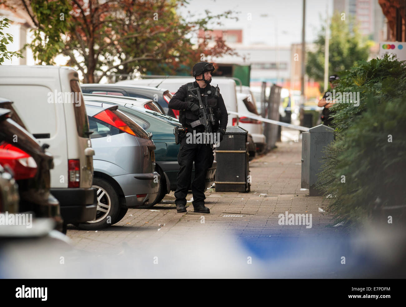 Glasgow, UK. 22nd Sep, 2014. Specialist Firearms officers from the Tactical Firearms Unit attend a siege in Boyd Street in Govanhill, Glasgow, in relation to a former prisoner Jonathan Kelly, 33, from the Drumchapel area of the city who went missing after breaching his bail conditions. September 22, 2014 Credit:  Sam Kovak/Alamy Live News Stock Photo