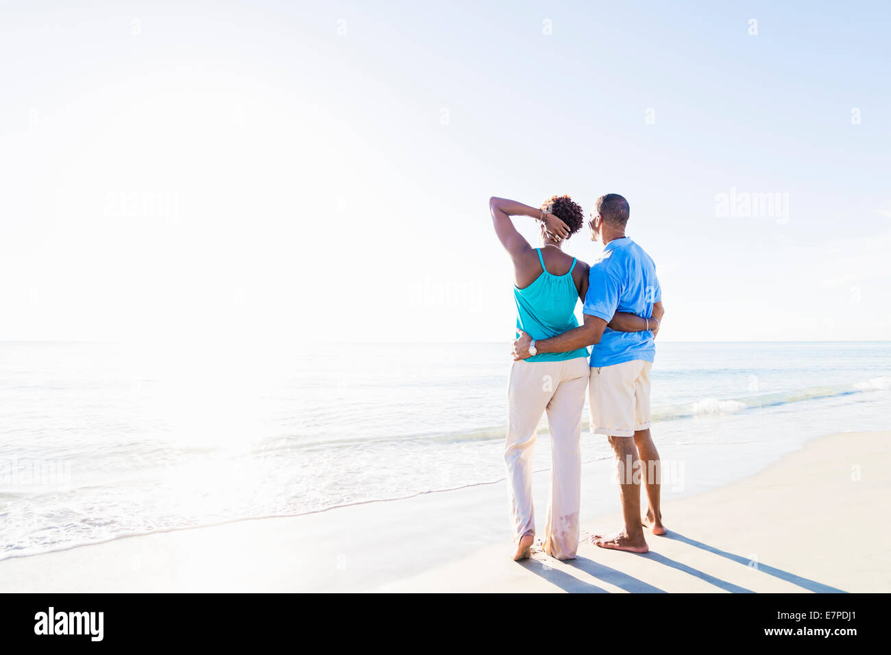 Mature couple standing on beach Stock Photo