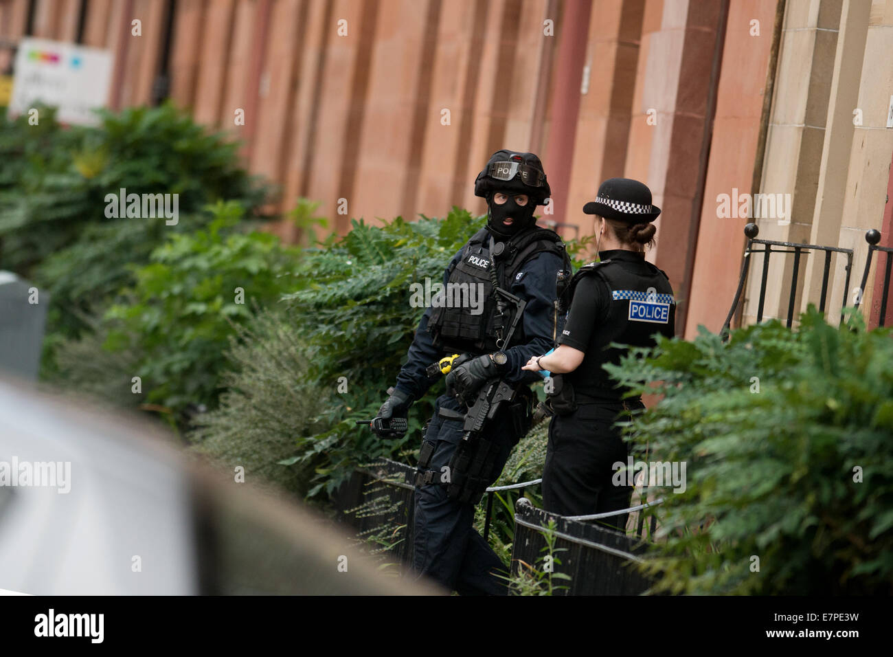 Glasgow, UK. 22nd Sep, 2014. Specialist Firearms officers from the Tactical Firearms Unit attend a siege in Boyd Street in Govanhill, Glasgow, in relation to a former prisoner Jonathan Kelly, 33, from the Drumchapel area of the city who went missing after breaching his bail conditions. September 22, 2014 Credit:  Sam Kovak/Alamy Live News Stock Photo