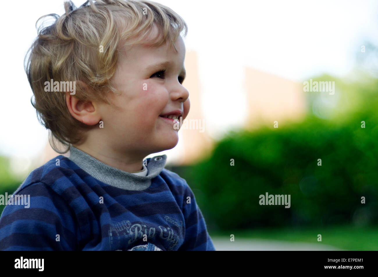 Portrait of a smiling young boy Stock Photo - Alamy