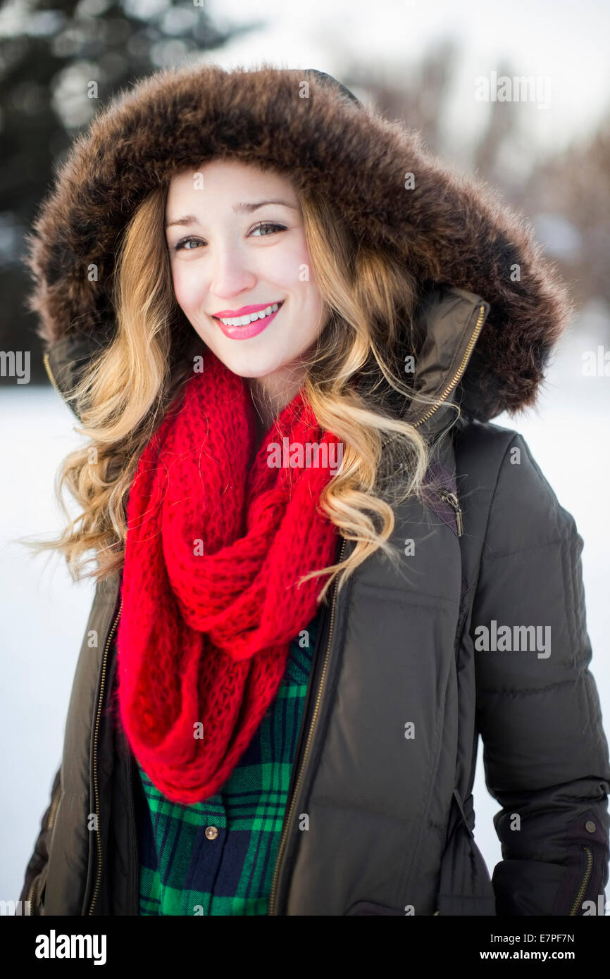 Portrait of woman wearing red scarf smiling outdoors Stock Photo Alamy