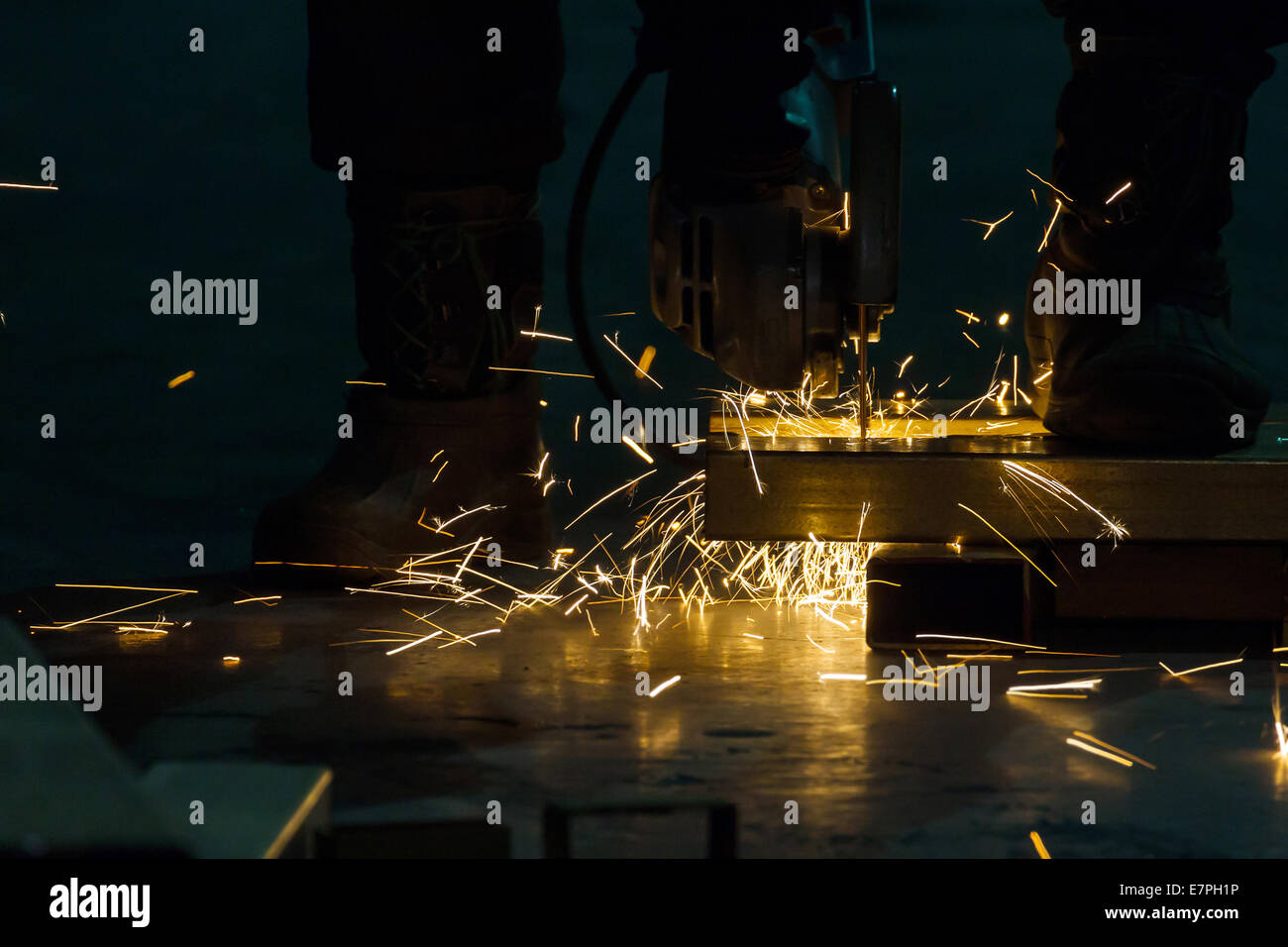 sharpening and cutting of iron by abrasive disk machine Stock Photo - Alamy