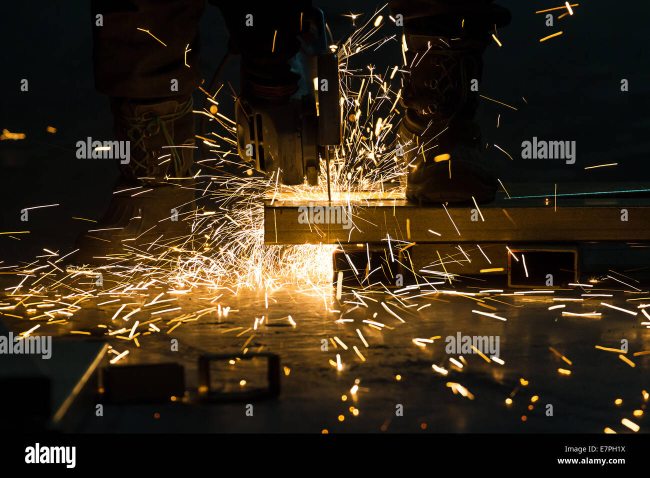 sharpening and cutting of iron by abrasive disk machine Stock Photo - Alamy