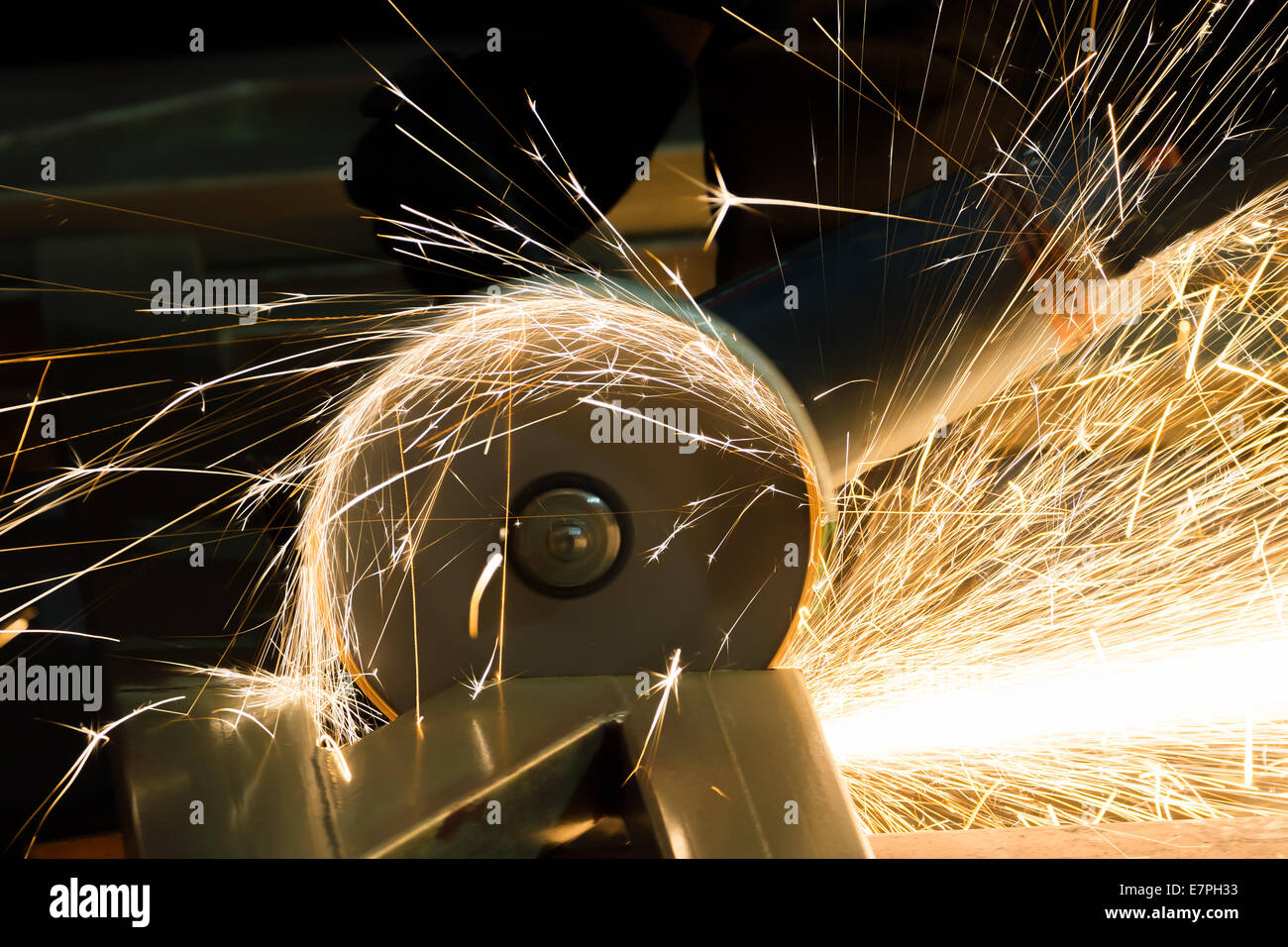 sharpening and cutting of iron by abrasive disk machine Stock Photo - Alamy