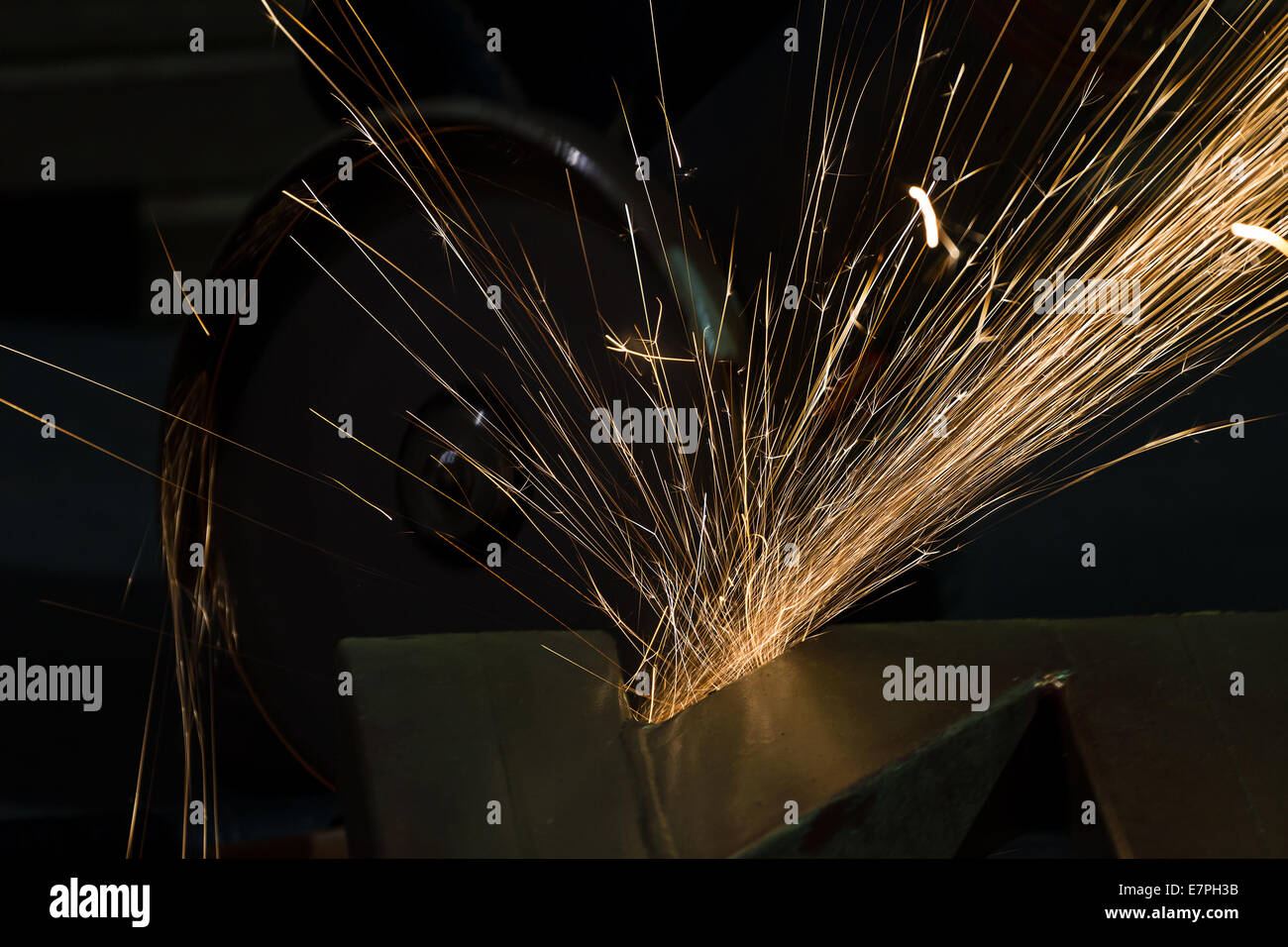 sharpening and cutting of iron by abrasive disk machine Stock Photo - Alamy