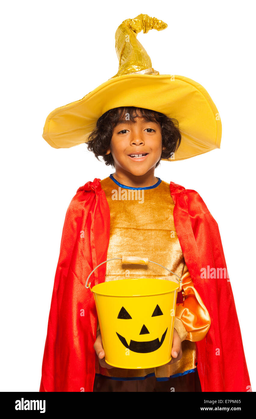 Boy in wizard costume with candy Halloween bucket Stock Photo