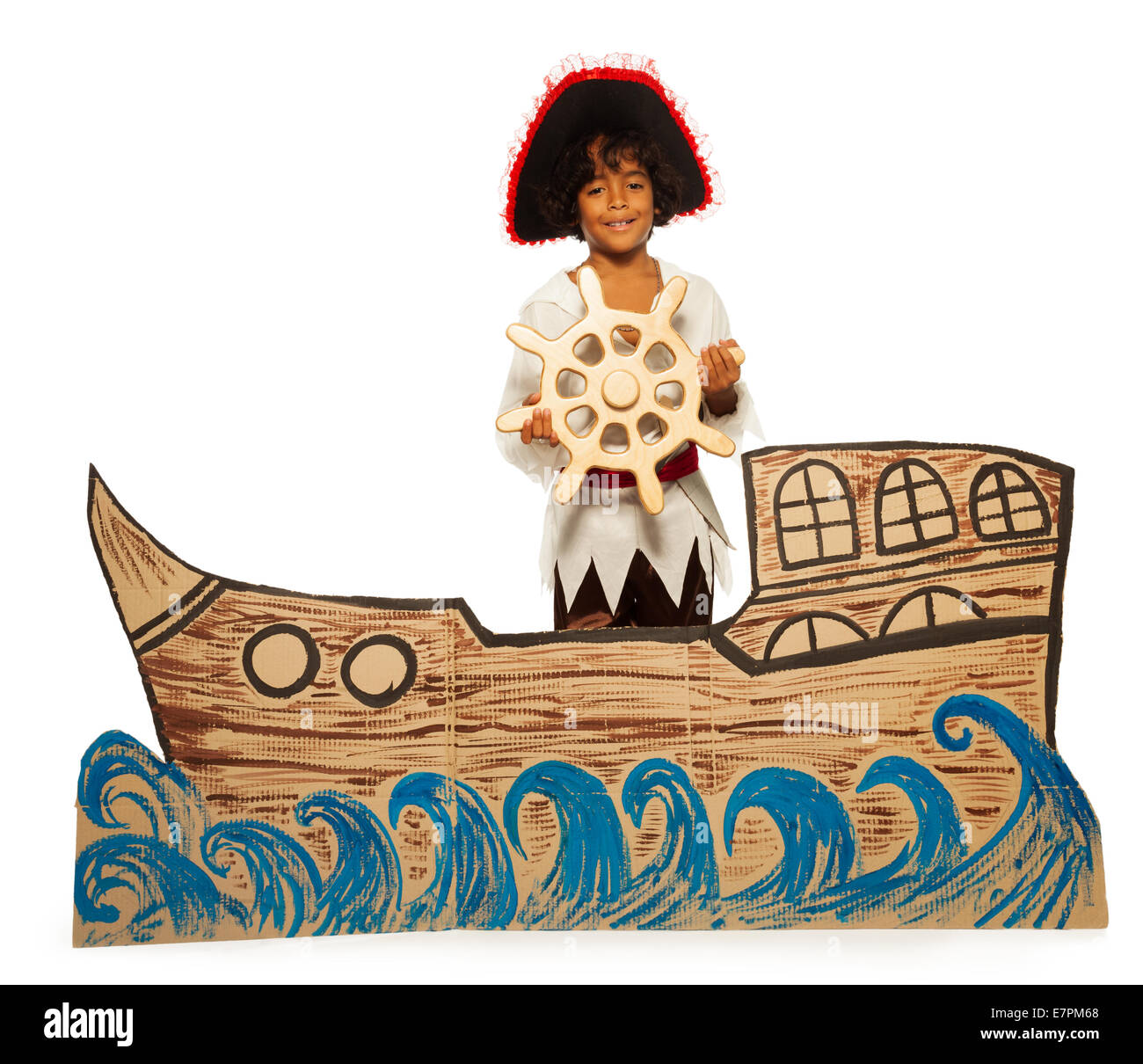 Boy playing pirate no cardboard ship steering Stock Photo