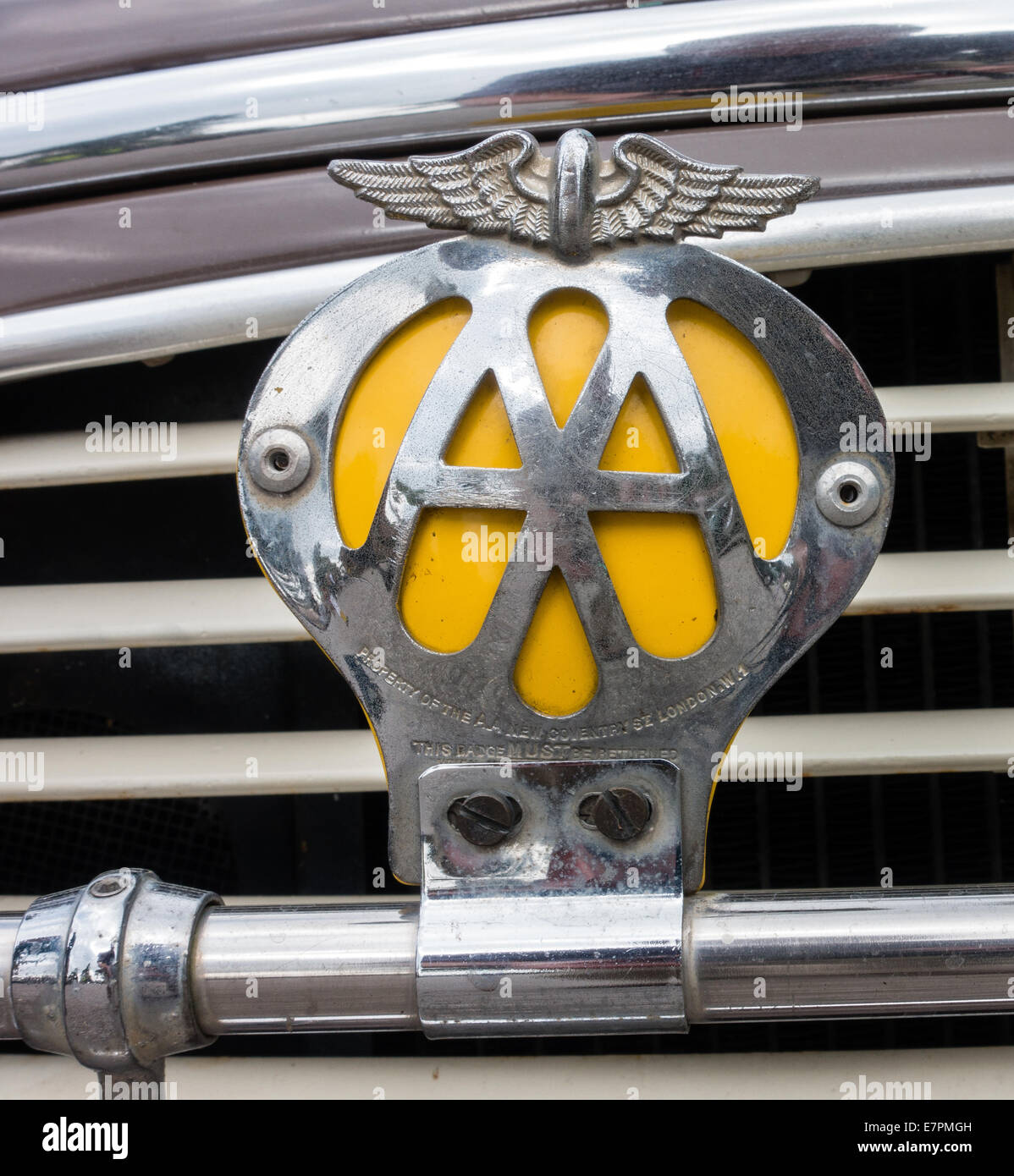 Antique chrome plated AA Automobile Association badge on a badge bar of a Morris Minor UK Stock