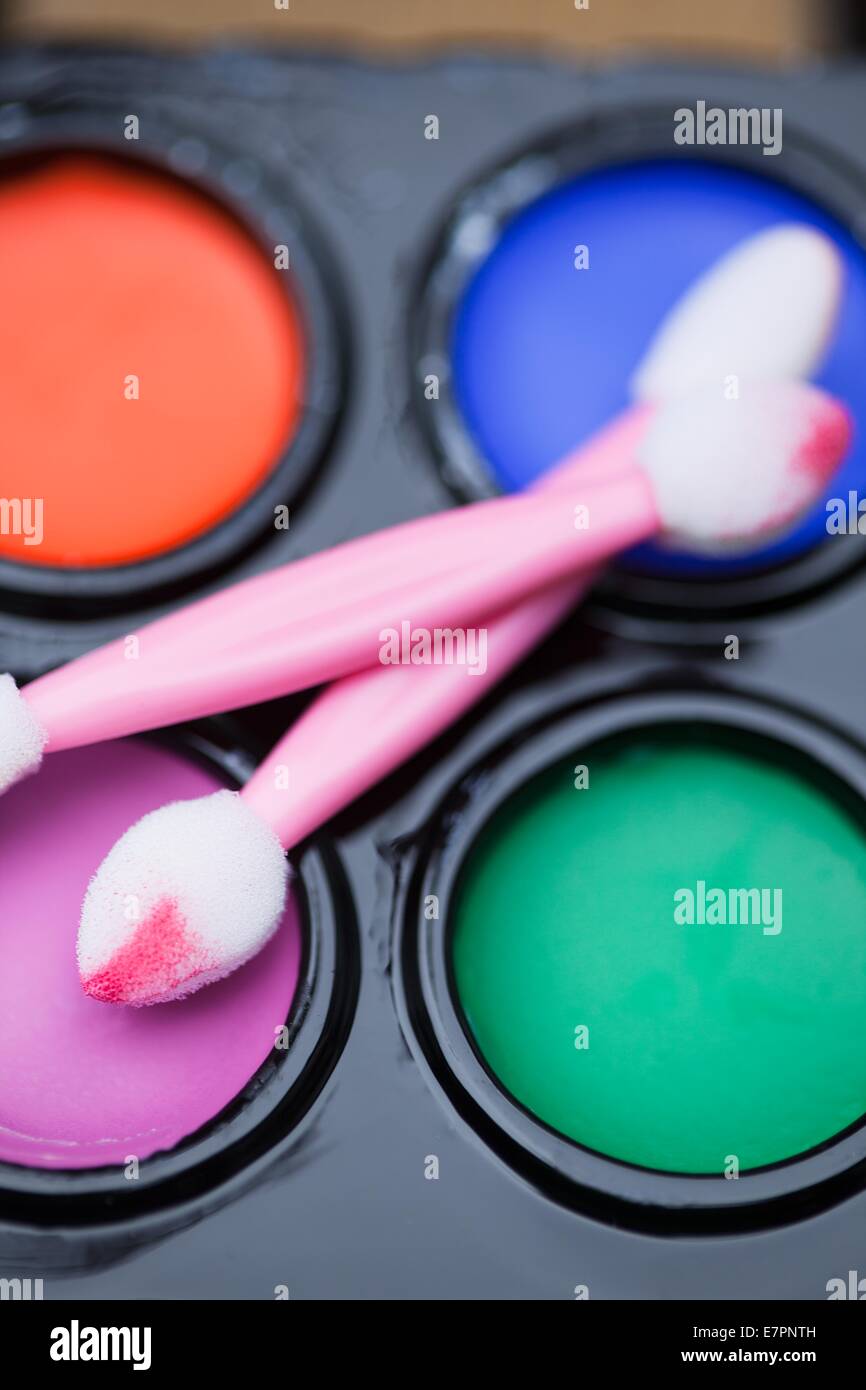 Kid's face paint with pink sponges Stock Photo Alamy