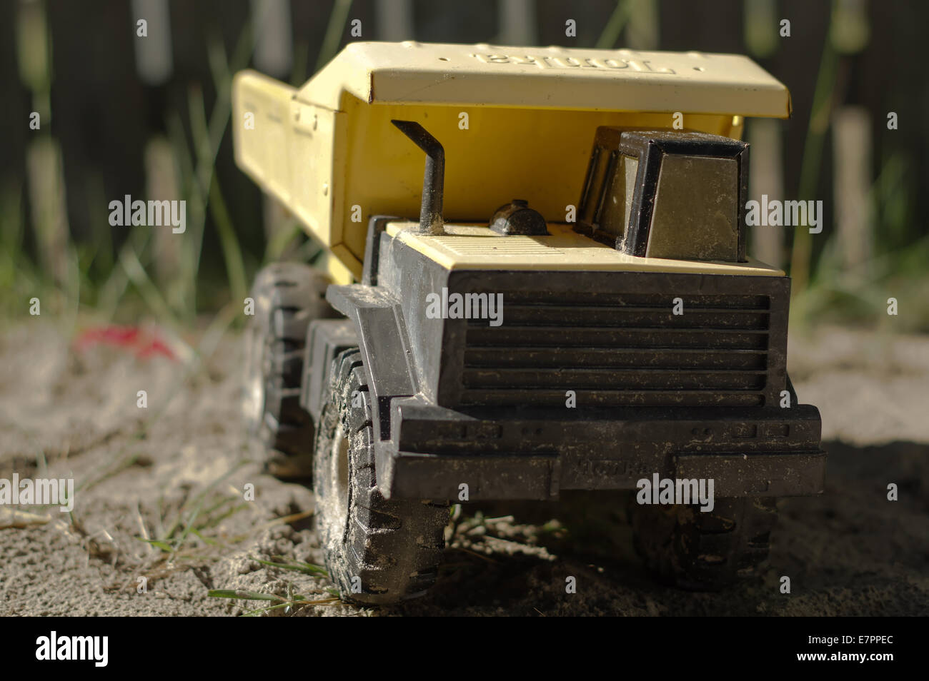Toy dump truck in the sand Stock Photo Alamy