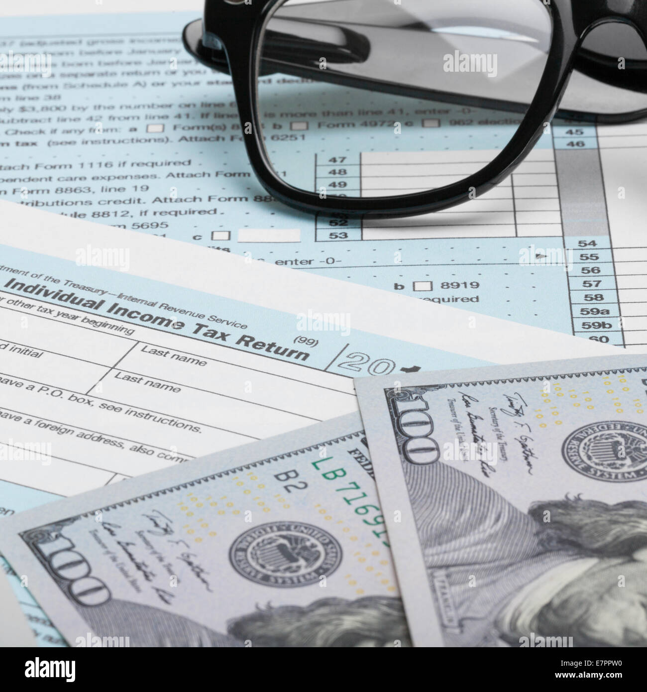 US Tax Form 1040 with calculator and 100 dollars - 1 to 1 ratio Stock ...