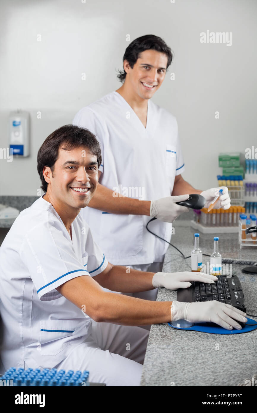Technicians Scanning Sample With Barcode Reader Stock Photo Alamy