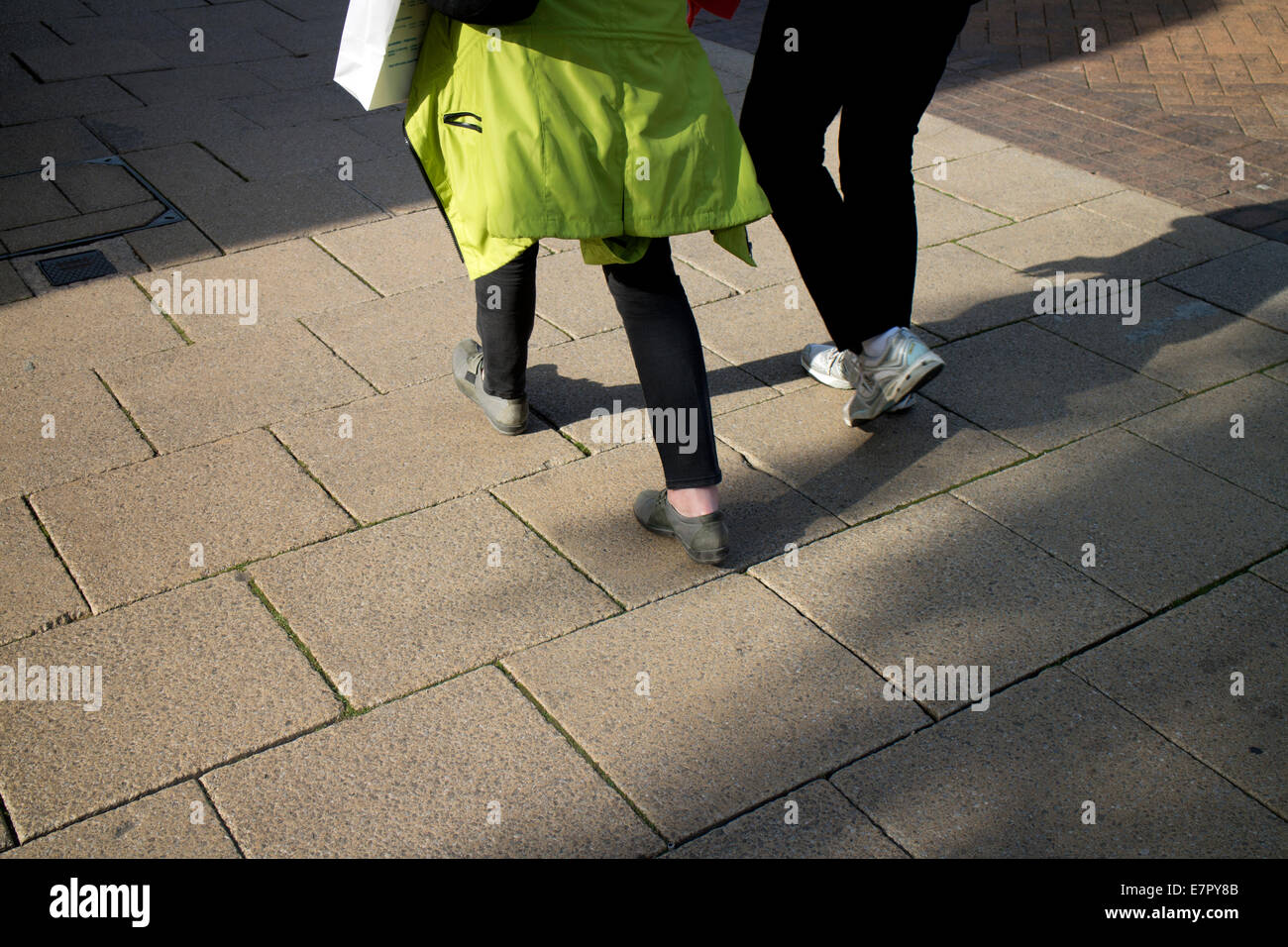 Two women walking pavement hi-res stock photography and images - Alamy