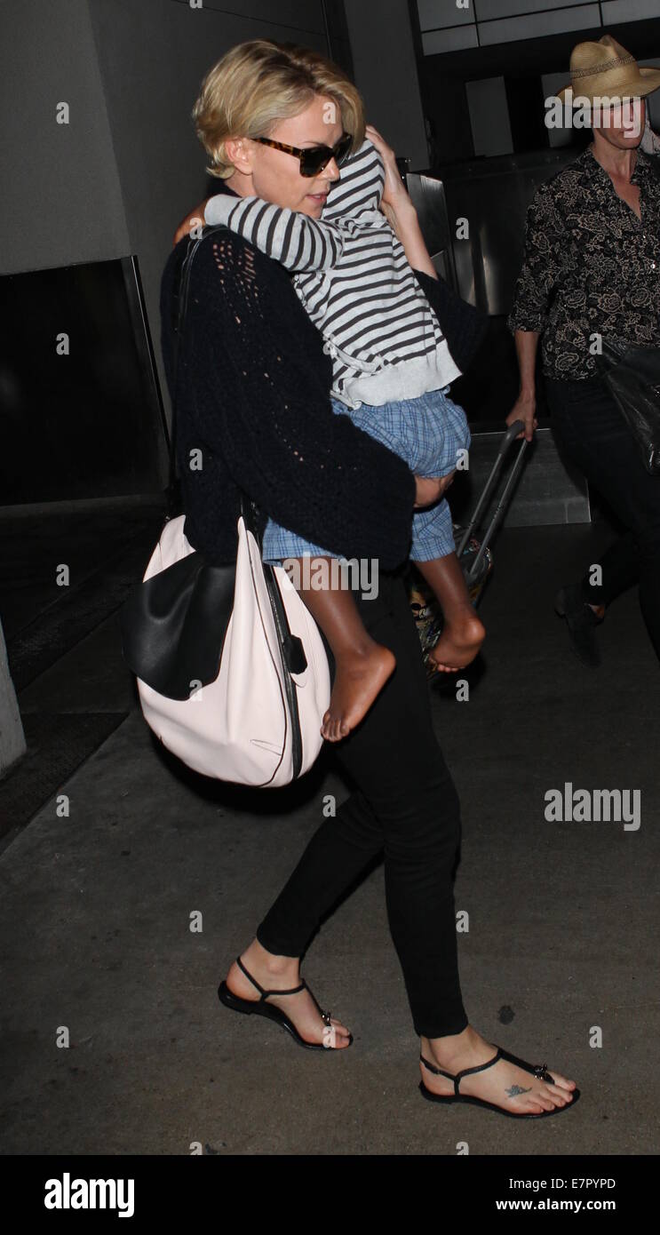 Charlize Theron arrives at Los Angeles International (LAX) airport carrying  her son Jackson in her arms