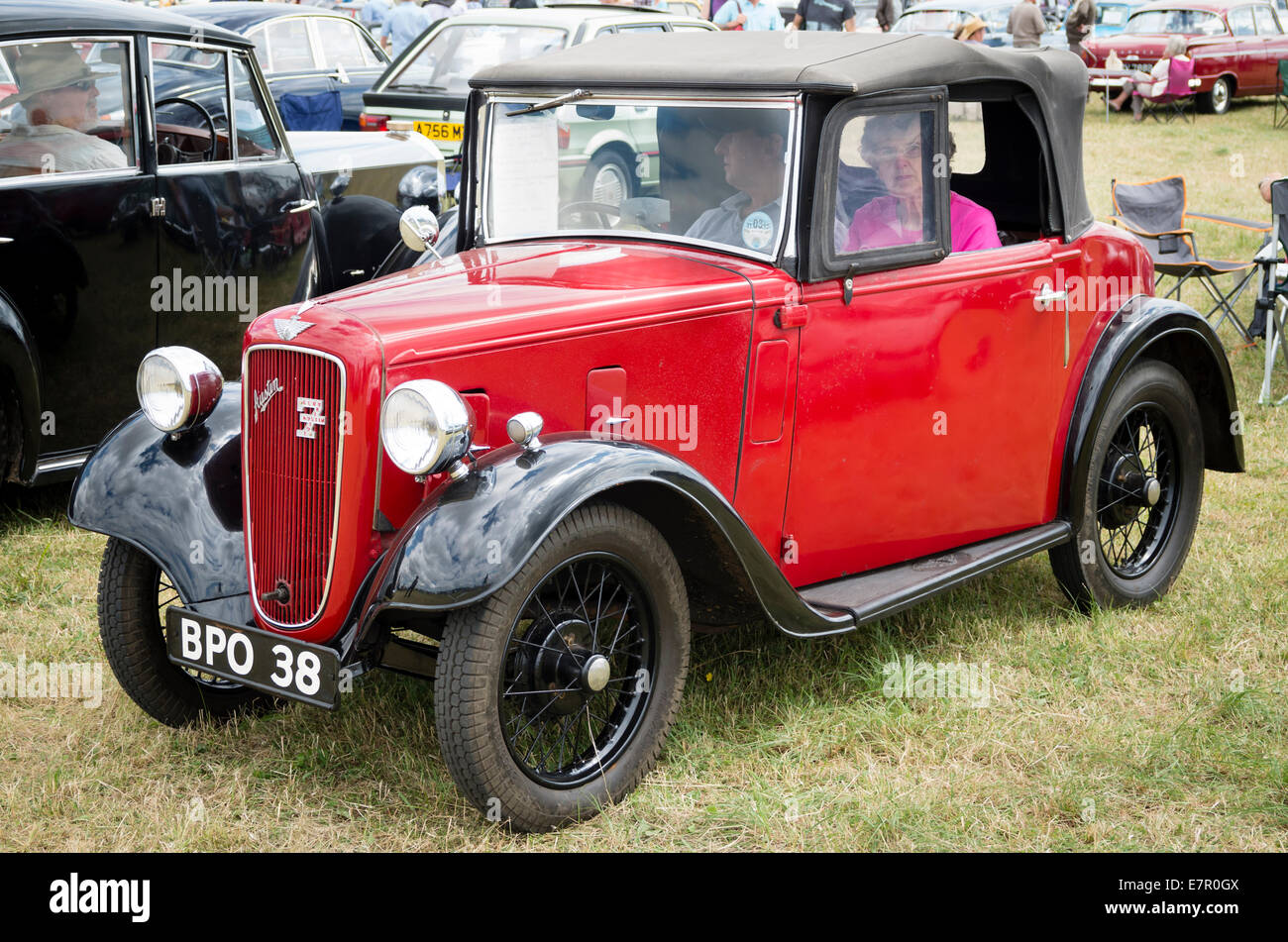 Couple sitting in their old Austin 7 automobile at an Englsih show Stock Photo