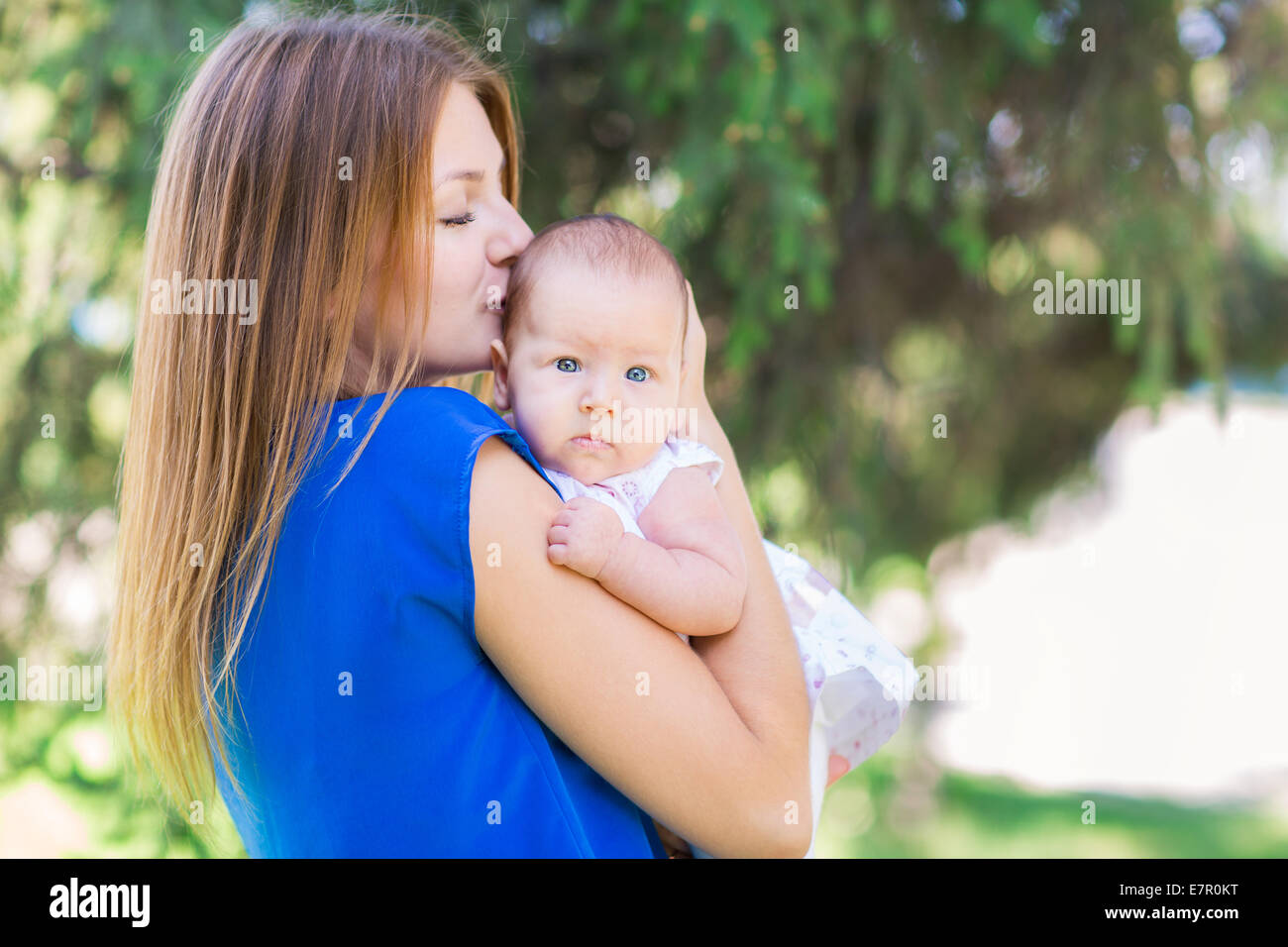 Beautiful Mother And Baby outdoors. Nature. Beauty Mum and her Child ...
