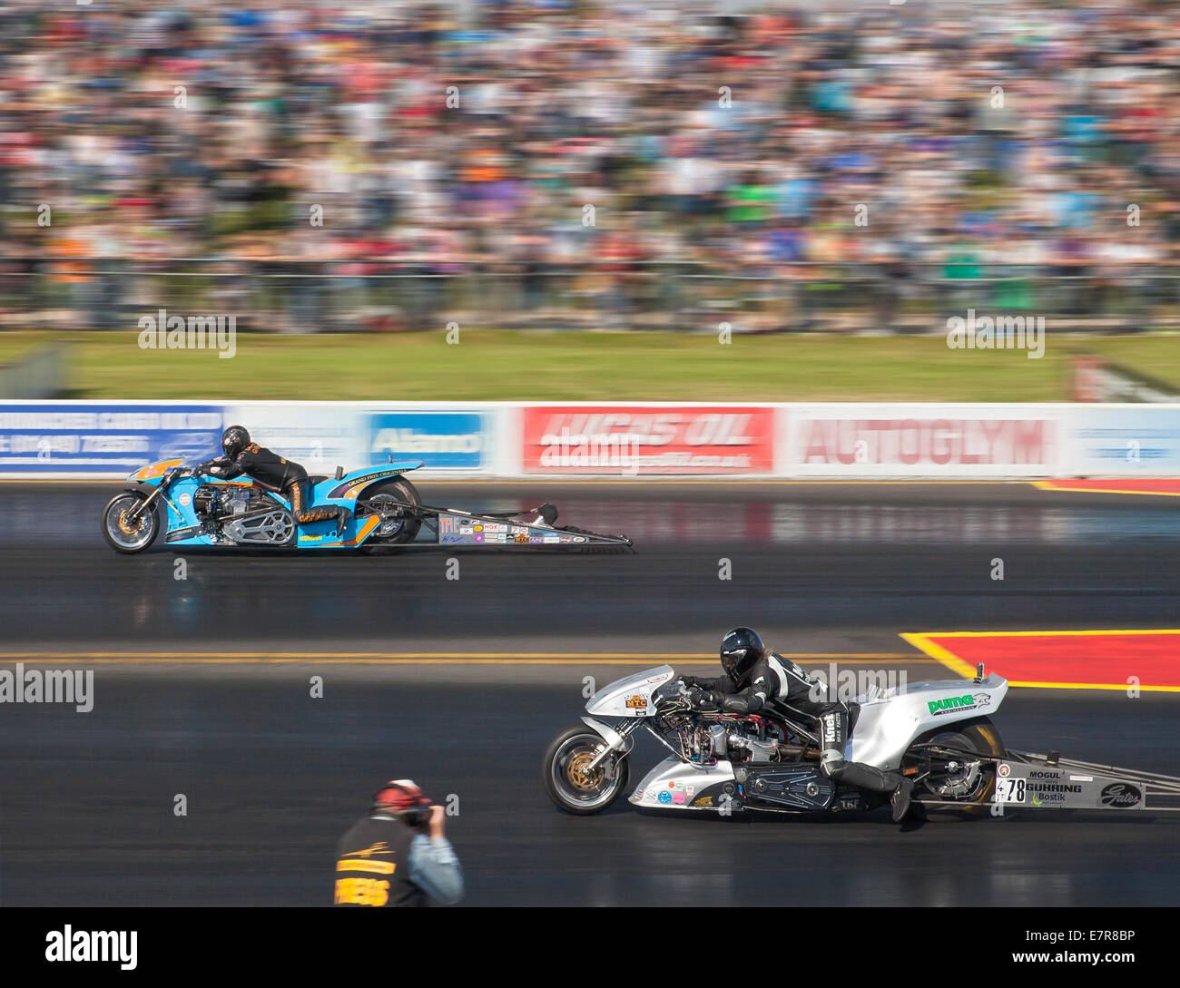 Top fuel drag bike racing at Santa Pod Raceway. Otto Knebl nearside, Ian King far side. Stock Photo