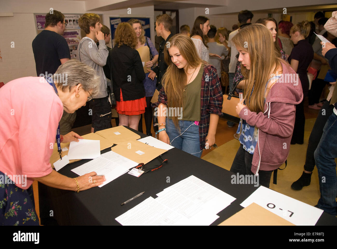 College students collecting their 2014 A Level Results, Farnham, Surrey, UK. Stock Photo