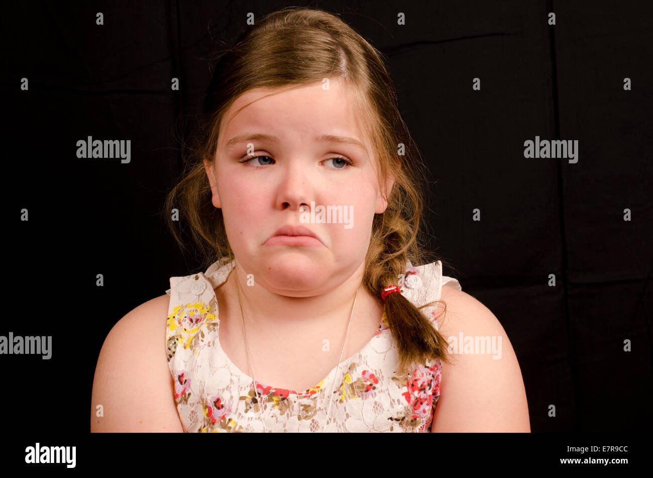 Premium Photo  Child girl sad profile face close up with hands on cheek.