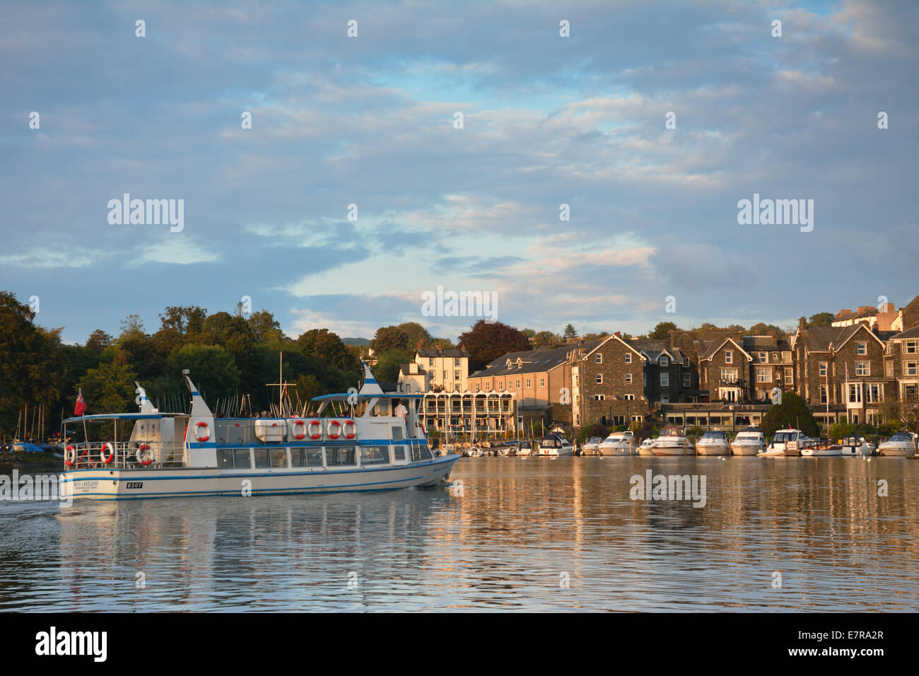 A Windermere cruiser entering Bowness in the early evening sunlight Stock Photo