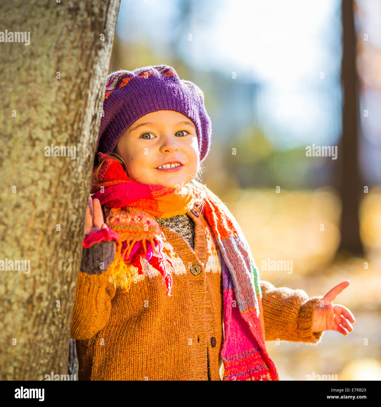 Happy little girl playing in the autumn park Stock Photo - Alamy