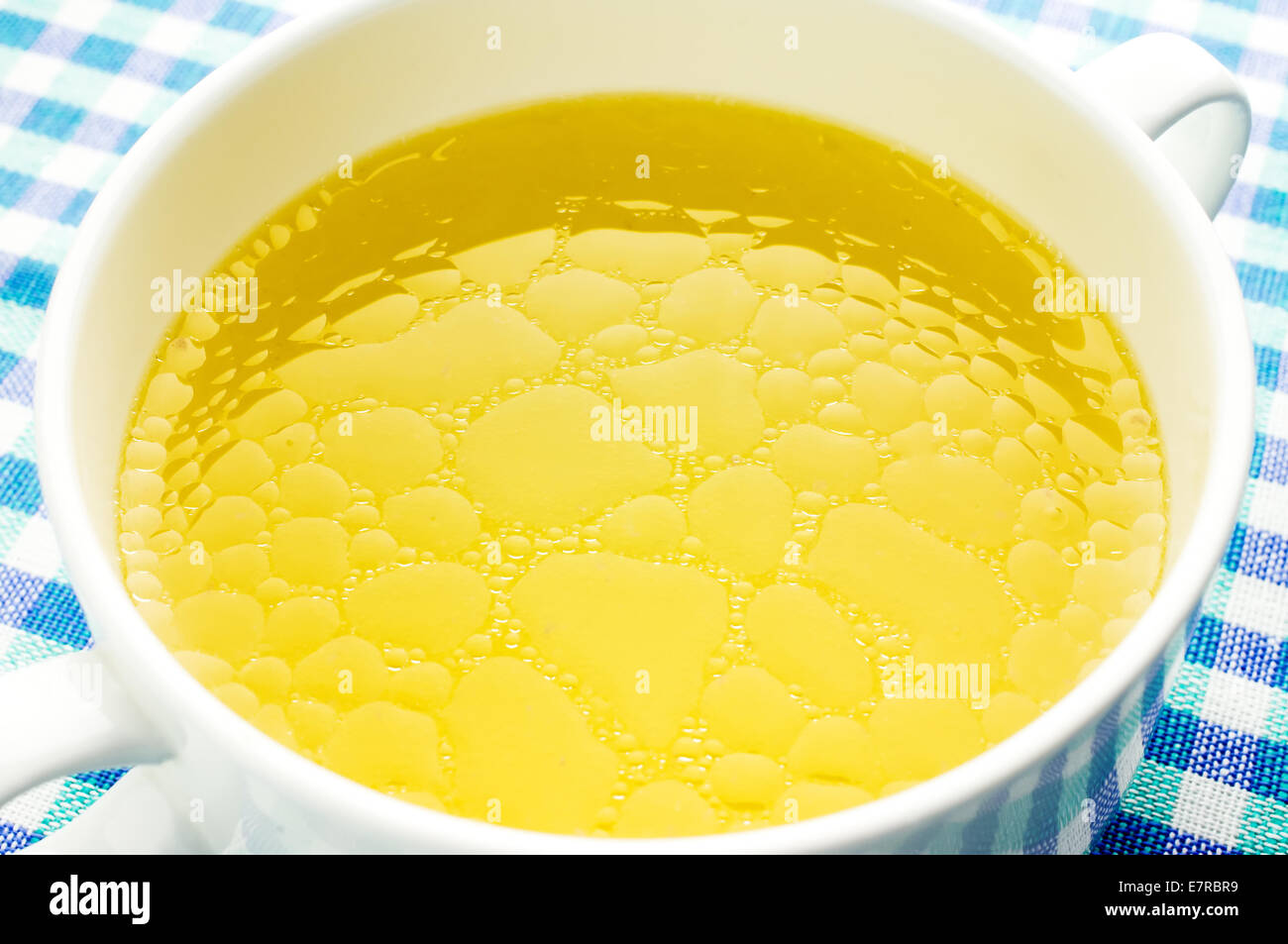 Fat oily broth, bouillon, clear soup close-up Stock Photo