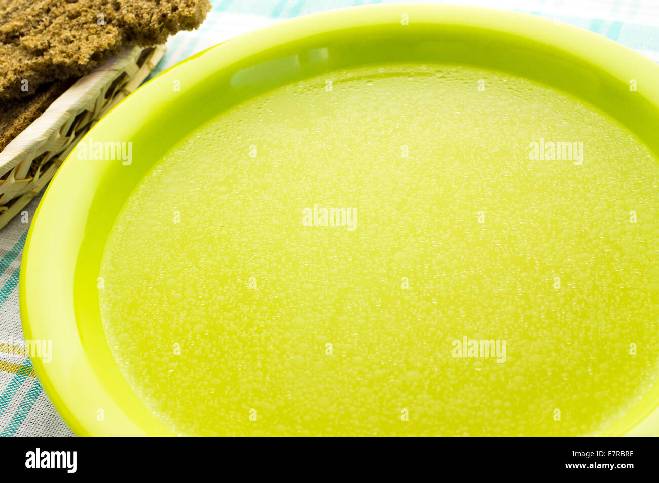 Clear soup, broth, bouillon in the green plate Stock Photo Alamy