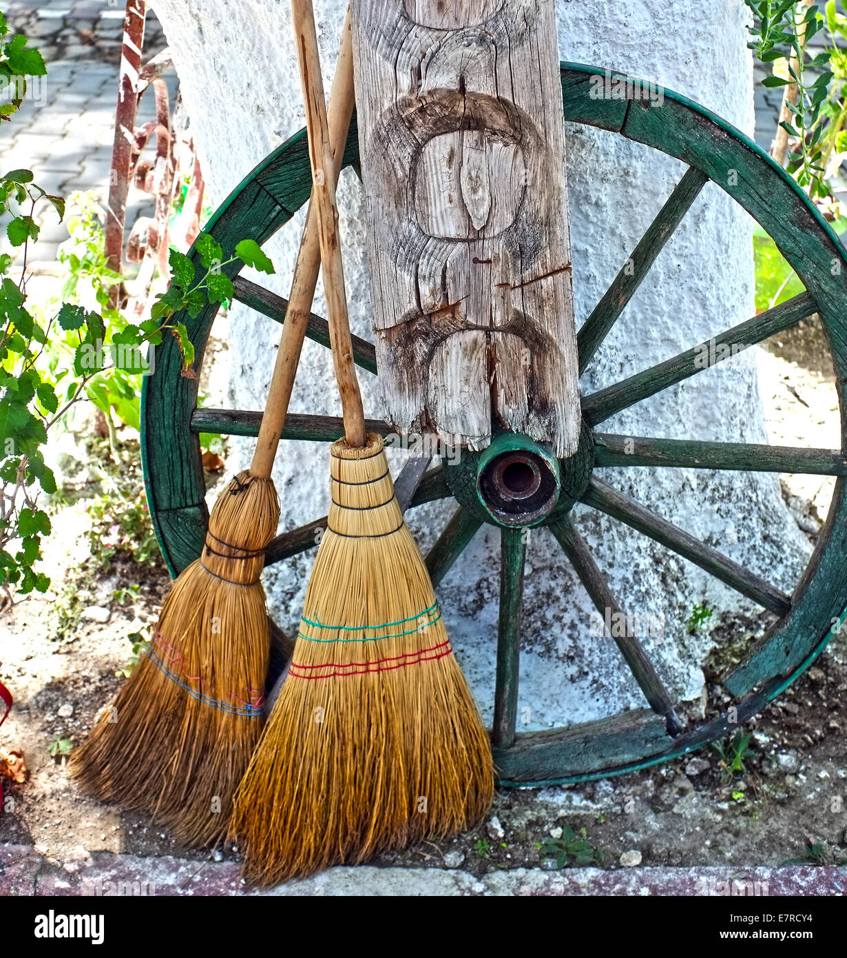 Straw broom with wooden wheel Stock Photo Alamy
