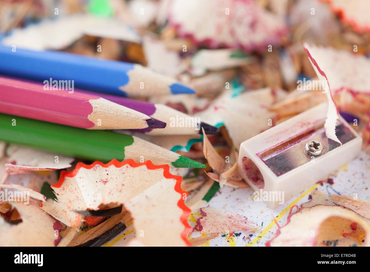Colored pencils with pencil shavings and pencil sharpener Stock Photo