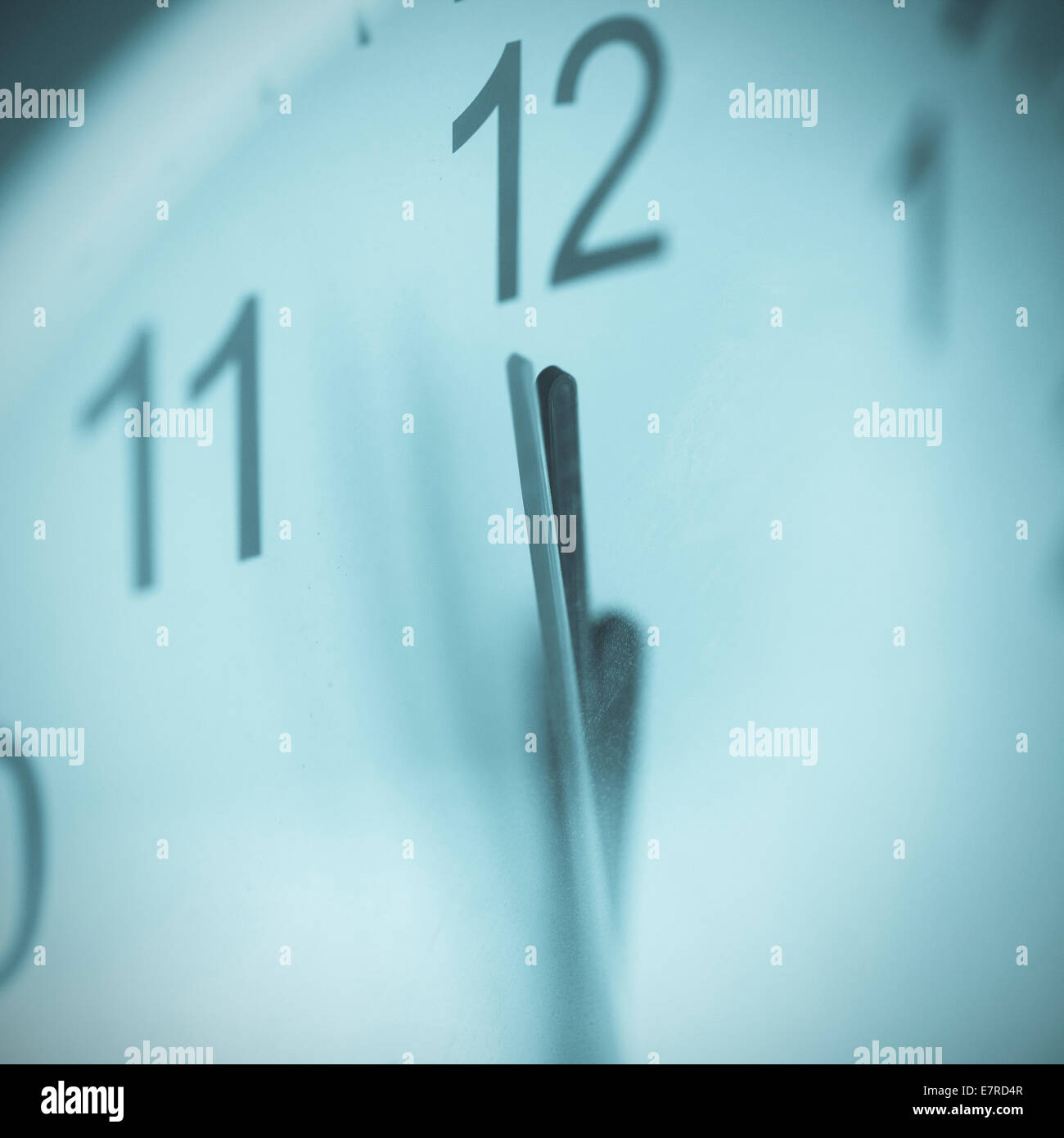 Last minute before deadline. There is some dust on glass of clock. Cross-processed image. Stock Photo