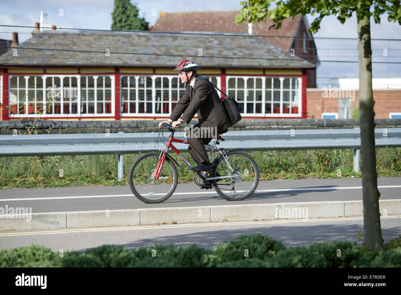 Commuter riding a bicycle Stock Photo