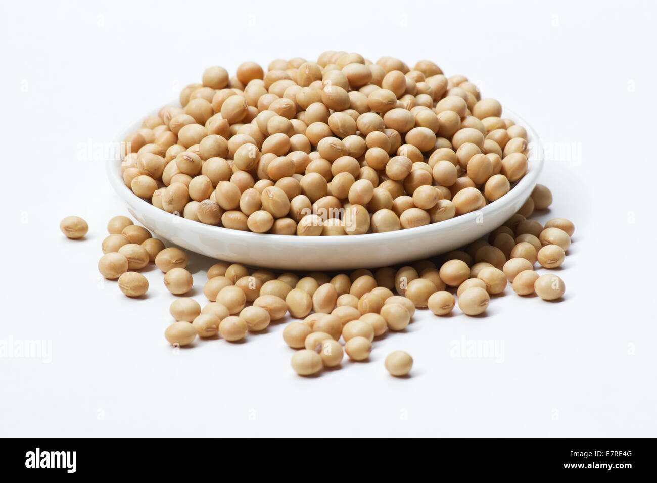 Soybeans (Glycine max)  in a white dish on white background Stock Photo
