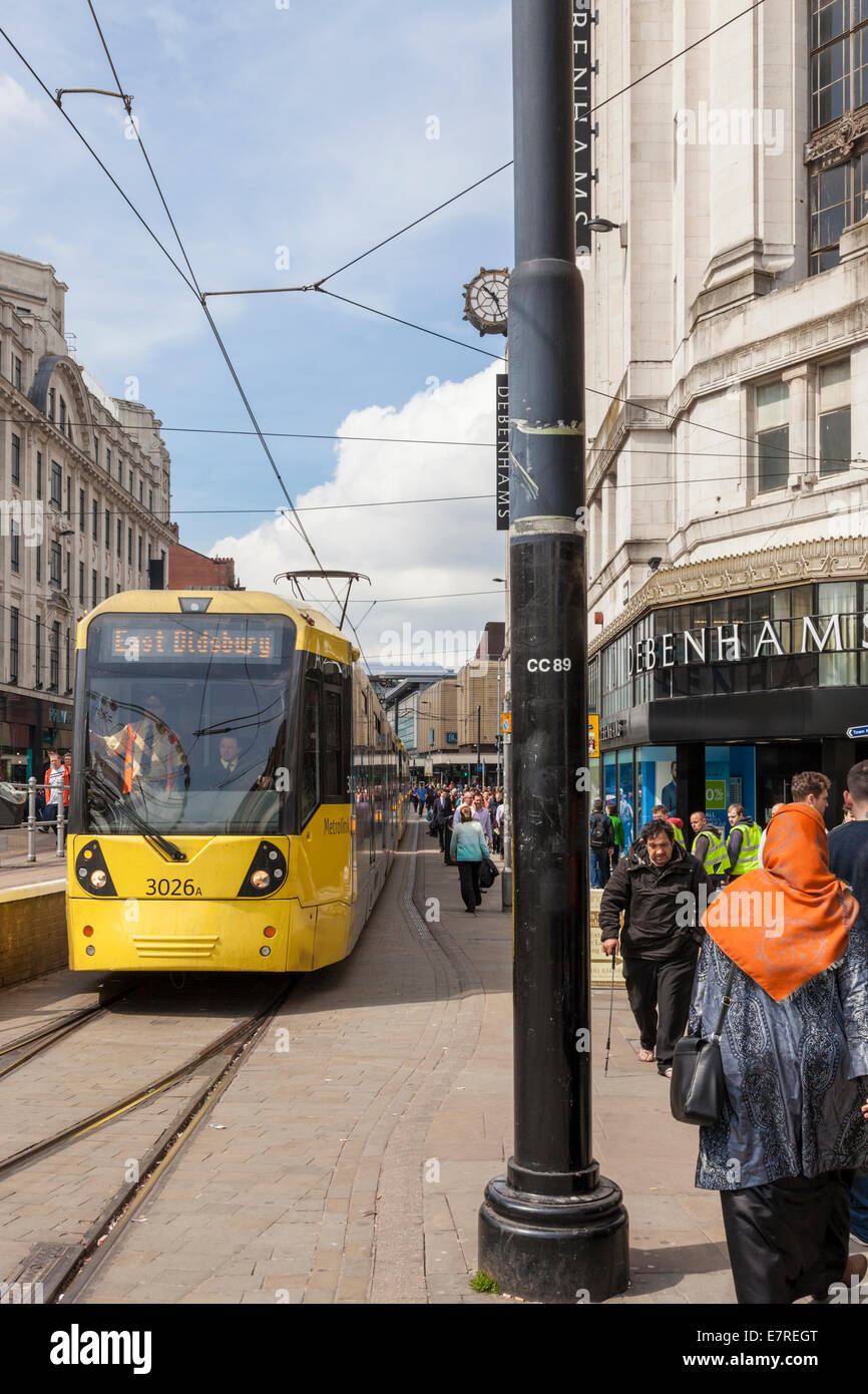 Metrolink tram on the busy Market Street in Manchester city centre, England, UK Stock Photo