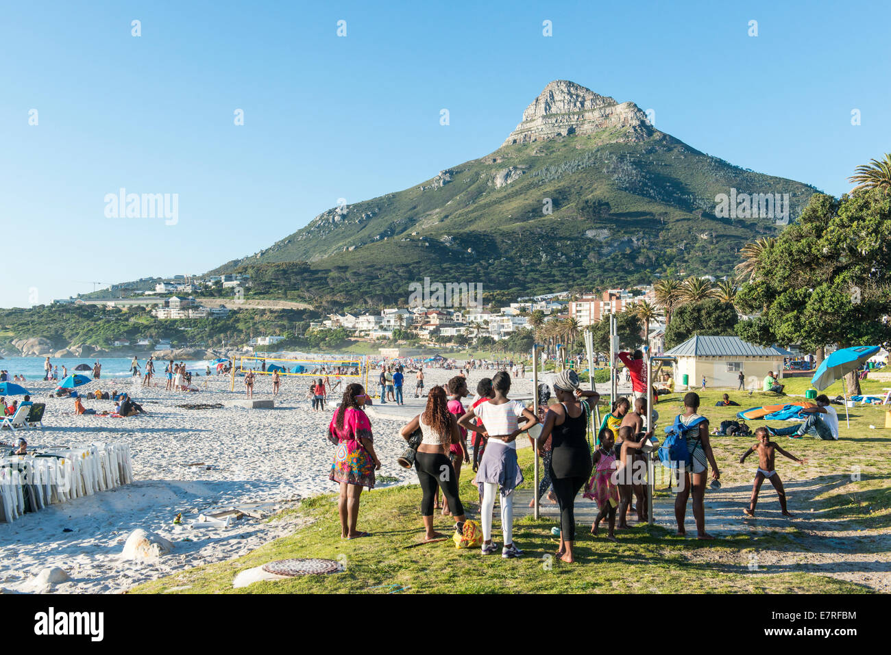 People taking a shower on the beach of Camps Bay, Cape Town, South
