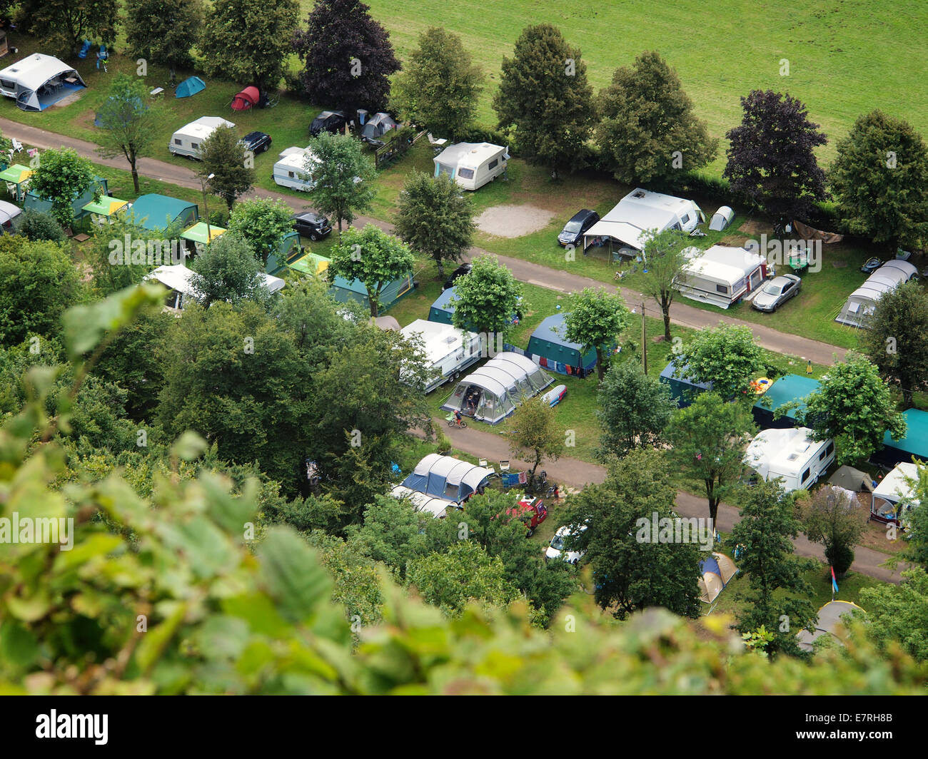 Busy camping site in sunny weather seen from above, Domaine de Chalain, Jura, France Stock Photo