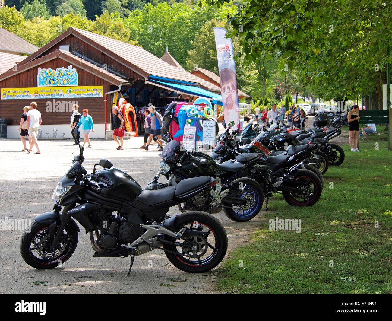 Line of parked motorcycles at Domaine the Chalain, Jura, France Stock Photo