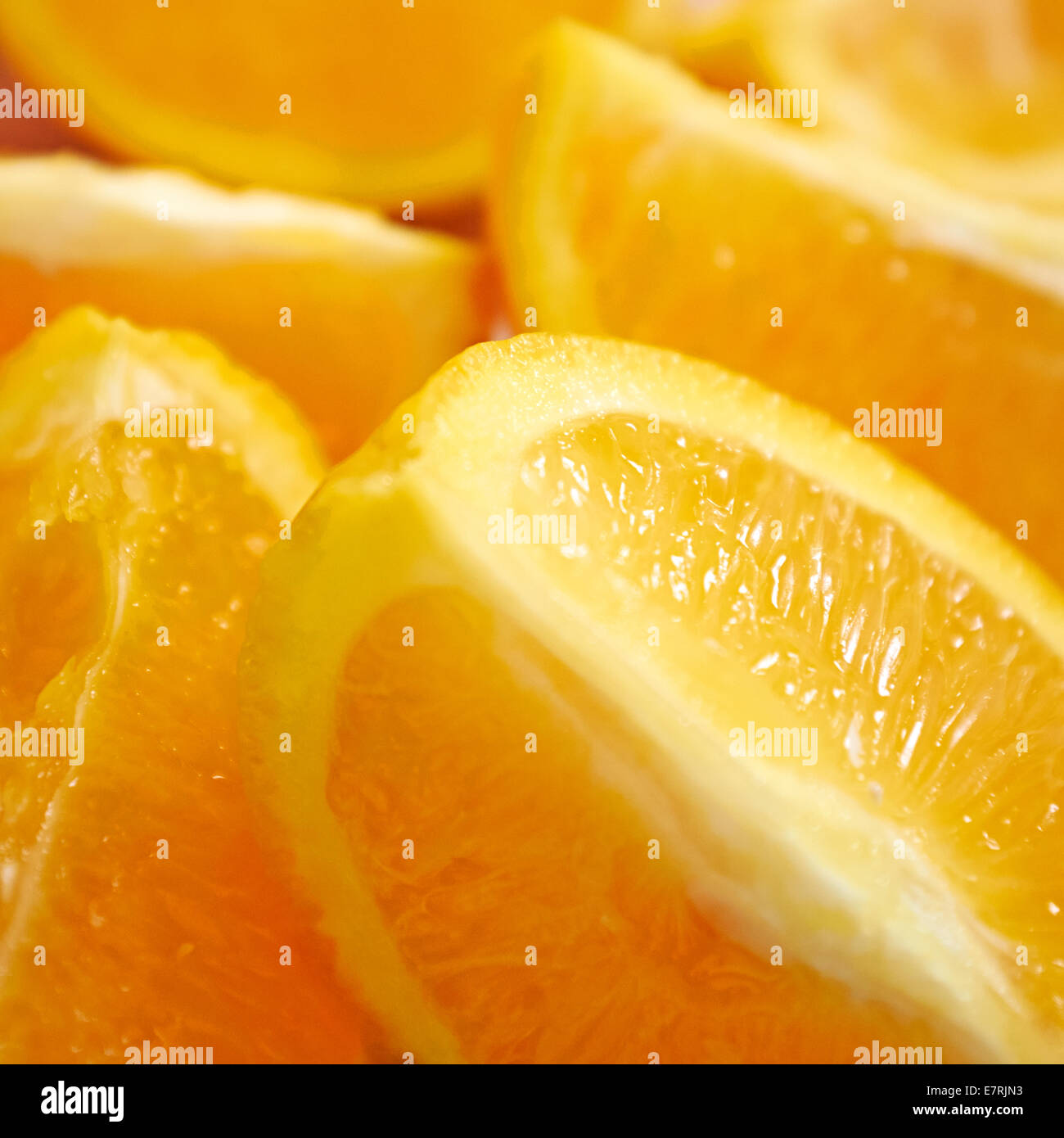 Close Up Of Juicy Orange Quarters. Stock Photo