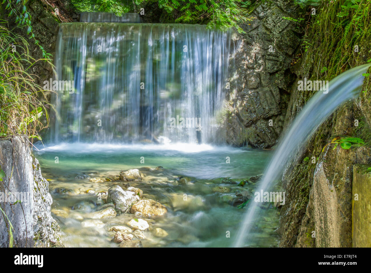 small waterfall in the woods Stock Photo