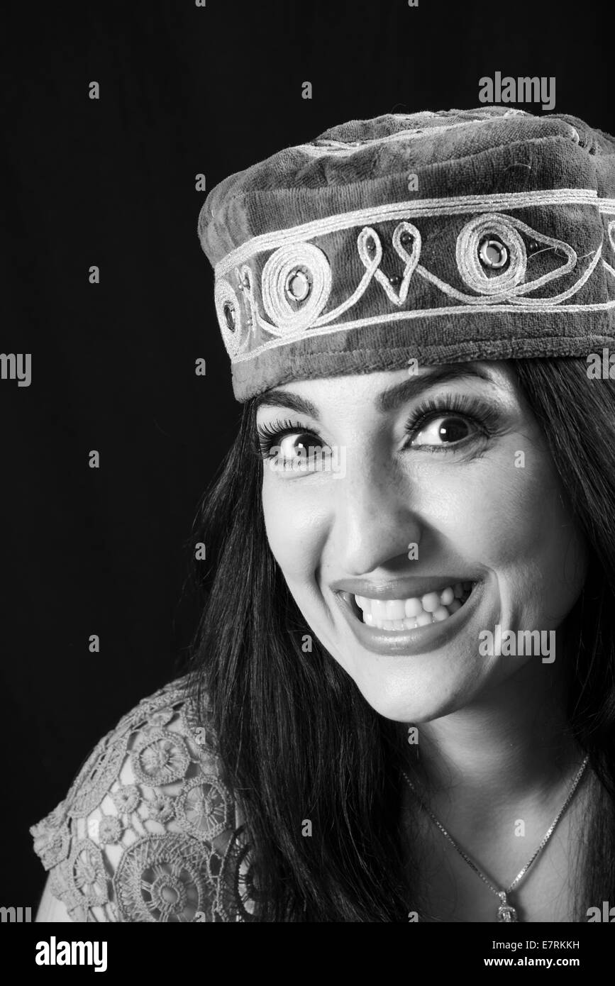 Woman wearing traditional middle eastern hat Stock Photo