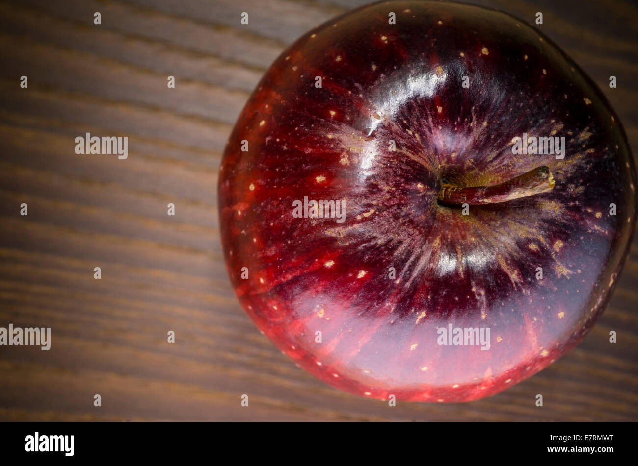 red apple on a wood surface Stock Photo - Alamy